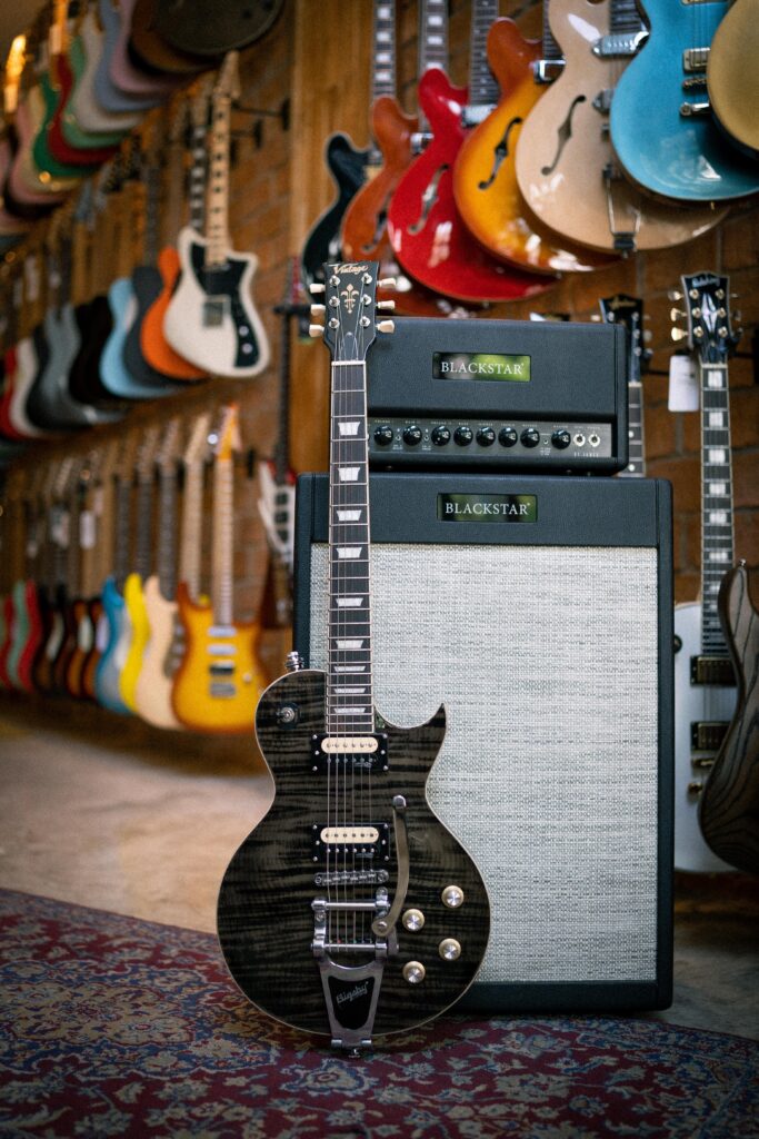 Vintage V100 Reissued Electric Guitar With Bigsby [Thru Black]
