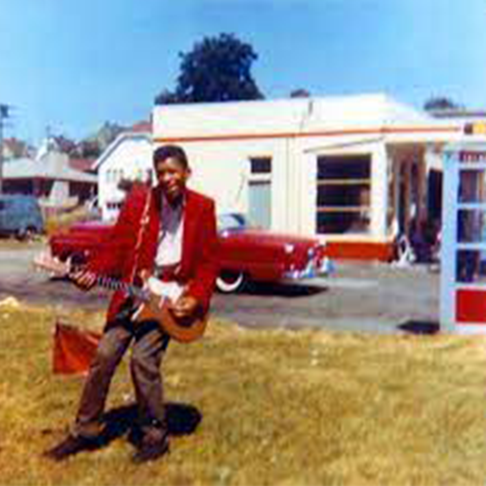 Jimi Hendrix at age 15 with his first electric guitar, 1957